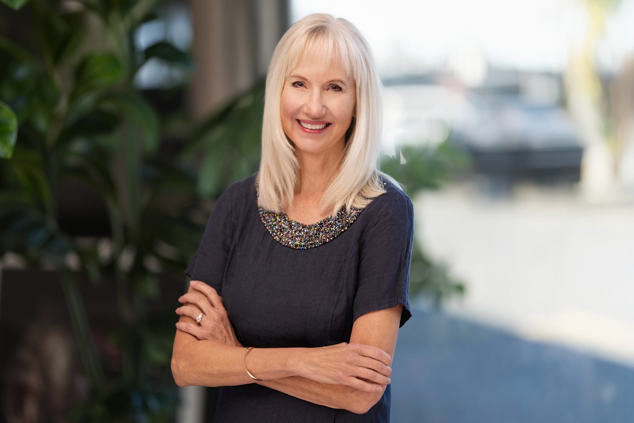 Cindi smiling in blue dress